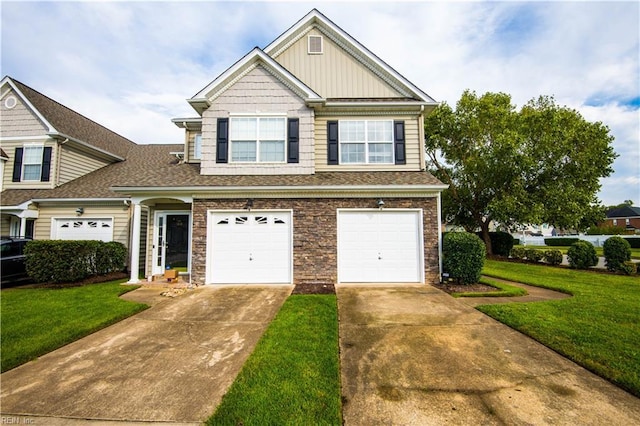 view of front of property featuring a front yard and a garage