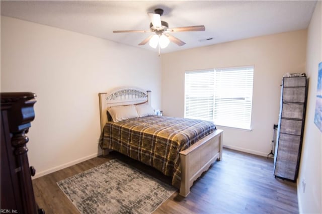 bedroom featuring ceiling fan and dark wood-type flooring