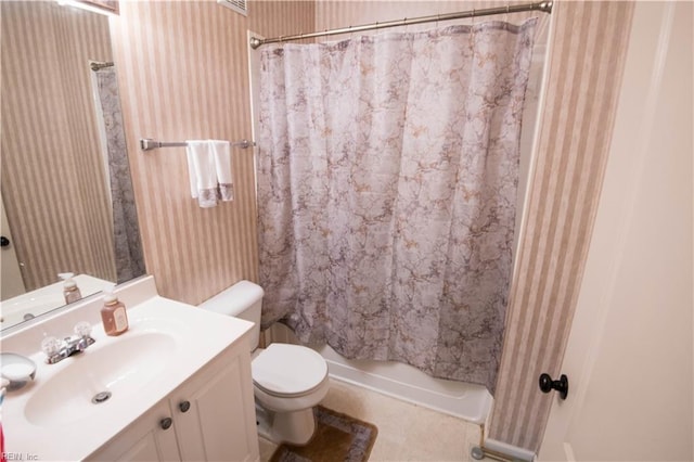 bathroom with tile patterned floors, vanity, and toilet