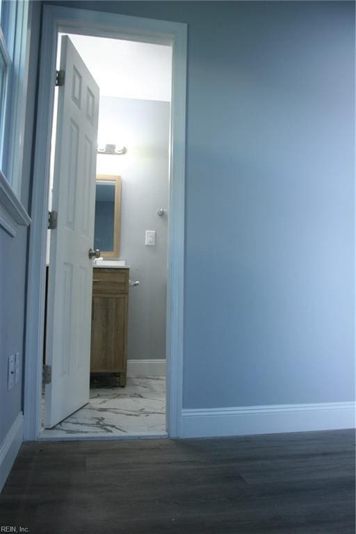 hallway featuring dark hardwood / wood-style floors