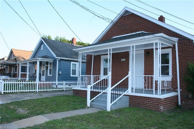 bungalow-style house featuring a front yard and a porch