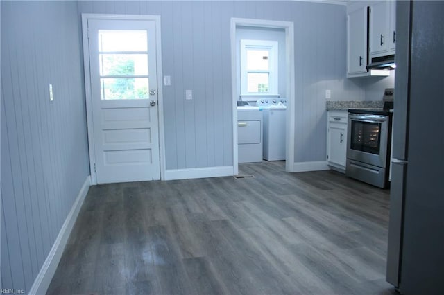 kitchen with white cabinets, stainless steel appliances, and dark hardwood / wood-style floors