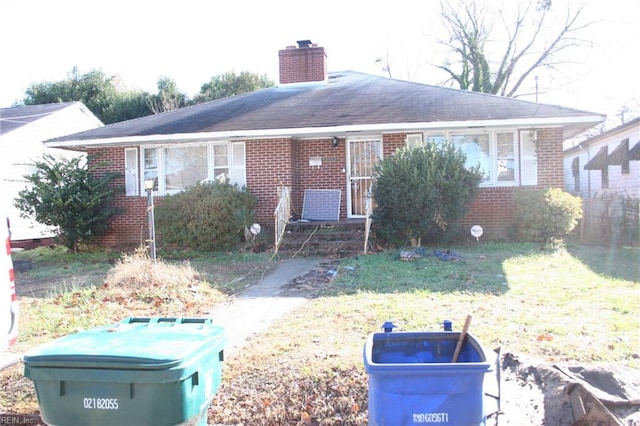 single story home featuring a front yard