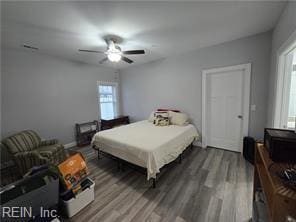 bedroom with ceiling fan and wood-type flooring