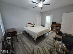 bedroom with hardwood / wood-style floors and ceiling fan