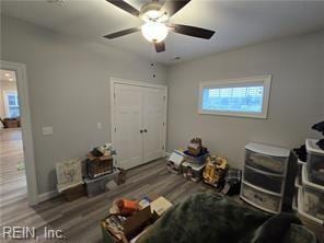 interior space featuring ceiling fan and hardwood / wood-style flooring