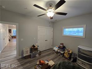 unfurnished bedroom featuring a closet, ceiling fan, and hardwood / wood-style floors