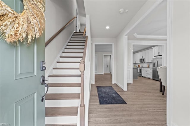 entryway with light hardwood / wood-style floors