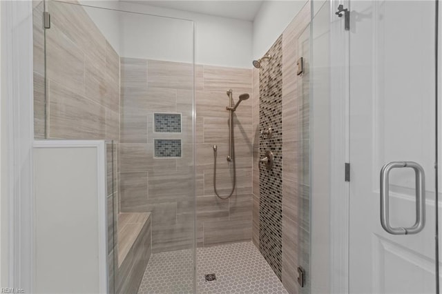 bathroom featuring an enclosed shower