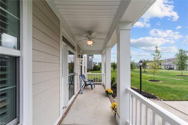 balcony with ceiling fan and a porch