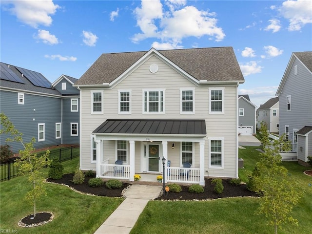 view of front of house with covered porch and a front lawn