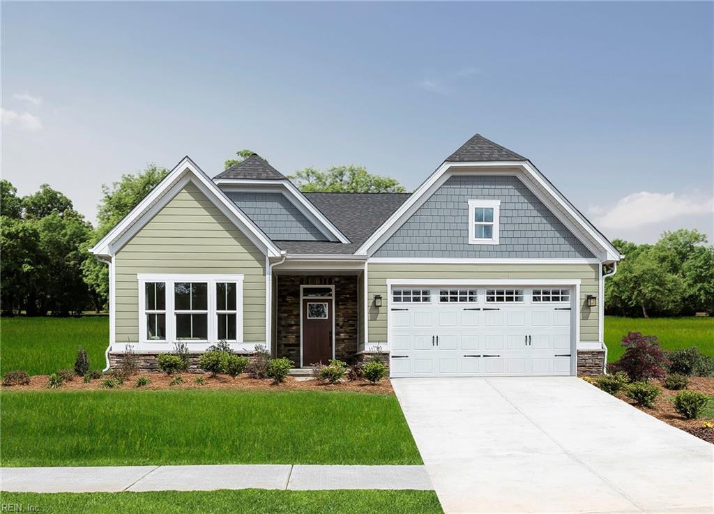 craftsman-style house featuring a front yard and a garage