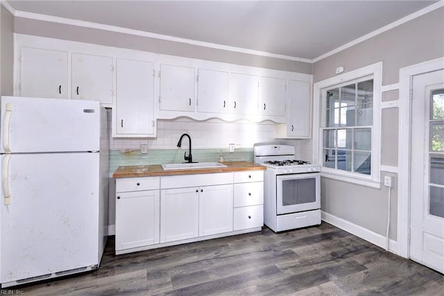 kitchen with dark hardwood / wood-style flooring, white appliances, crown molding, sink, and white cabinetry