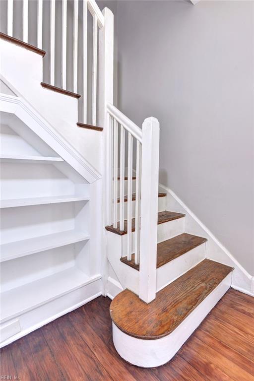 staircase featuring hardwood / wood-style floors