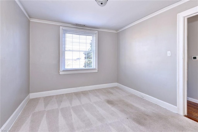 carpeted empty room with ornamental molding