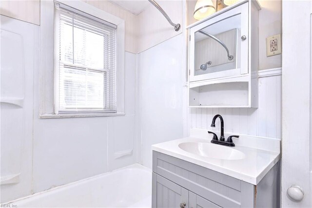 bathroom with shower / bathing tub combination and vanity