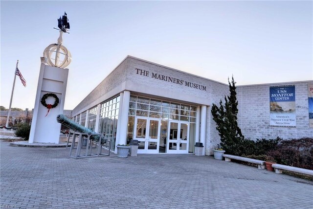 view of outdoor building at dusk