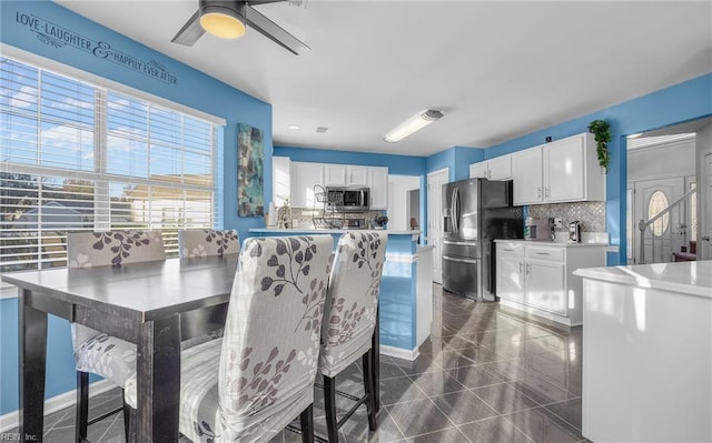 dining room with ceiling fan