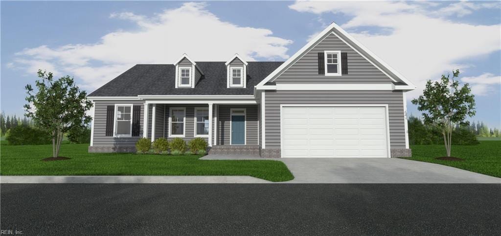 view of front of home with a front yard and a garage