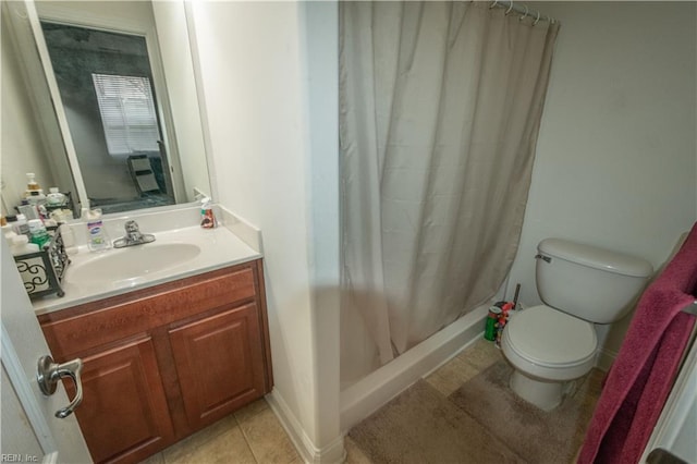 bathroom with tile patterned flooring, vanity, curtained shower, and toilet