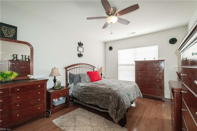 bedroom featuring ceiling fan and dark hardwood / wood-style floors