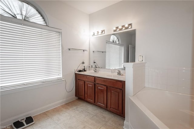 bathroom featuring vanity and a tub