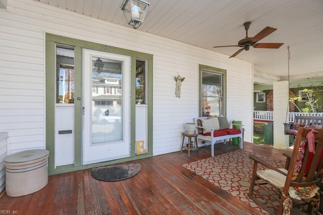 exterior space featuring ceiling fan and a porch