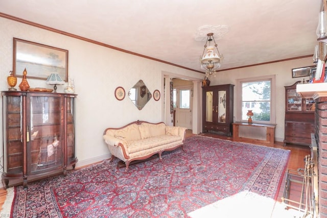 living room with hardwood / wood-style floors and ornamental molding