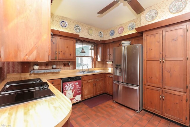 kitchen with dark tile patterned flooring, sink, ceiling fan, butcher block counters, and stainless steel appliances