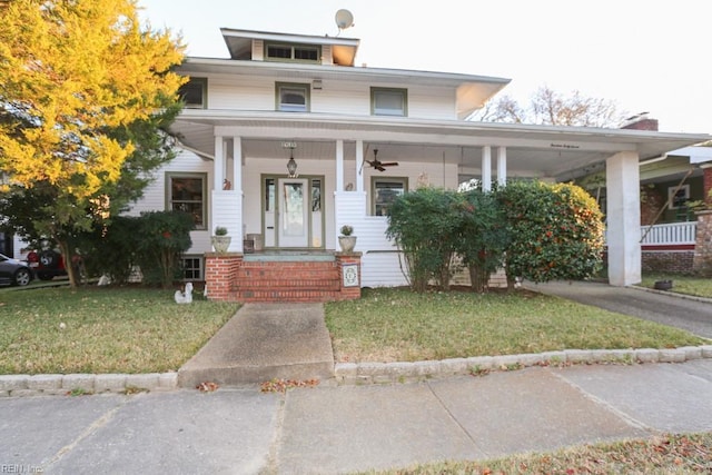 view of front of house featuring a porch and a front yard