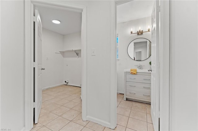 bathroom with tile patterned flooring and vanity