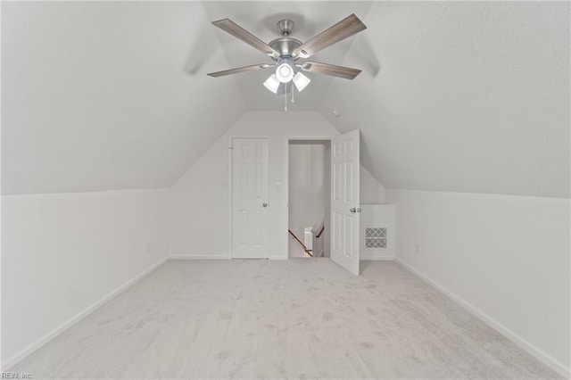 bonus room featuring light colored carpet, ceiling fan, and lofted ceiling