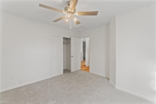 unfurnished bedroom featuring ceiling fan, a closet, and light colored carpet