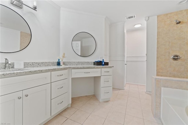 bathroom with tile patterned floors, vanity, ornamental molding, and tiled shower