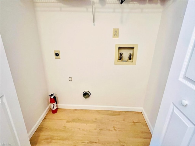 laundry area featuring washer hookup, wood-type flooring, and electric dryer hookup