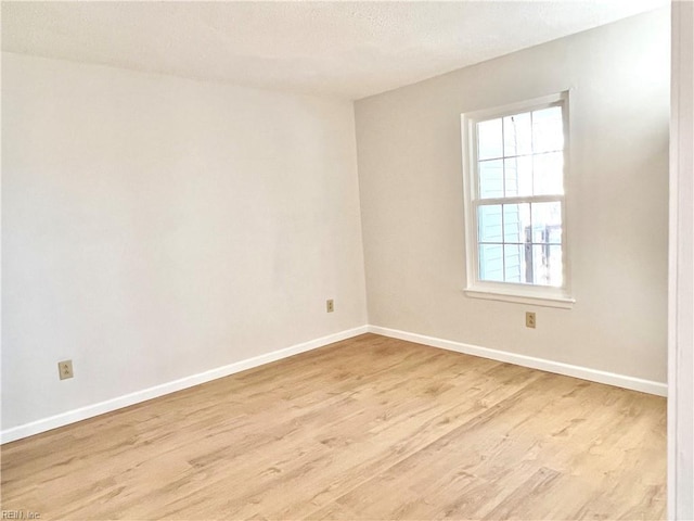 unfurnished room featuring light wood-type flooring