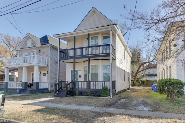 view of front of house featuring a porch and a balcony