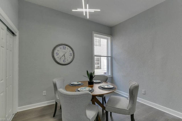 dining space with dark wood-type flooring