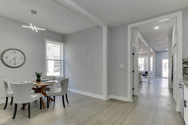 dining space with light wood-type flooring