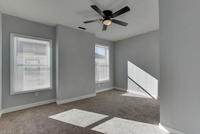 unfurnished room featuring carpet floors and ceiling fan