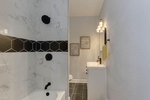 full bathroom featuring vanity, toilet, and tiled shower / bath