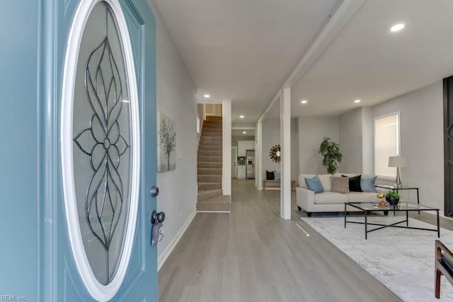 foyer entrance with light wood-type flooring