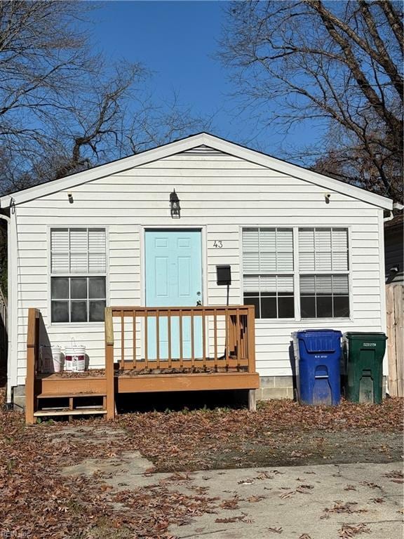 back of house featuring a deck