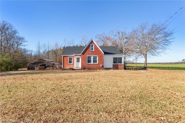 view of side of property with a yard and a carport