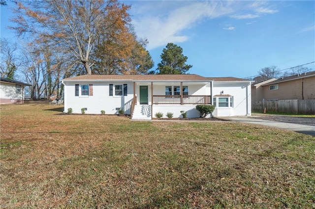 single story home featuring a porch and a front lawn