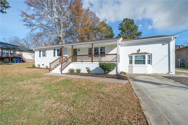 view of front of home with covered porch and a front yard