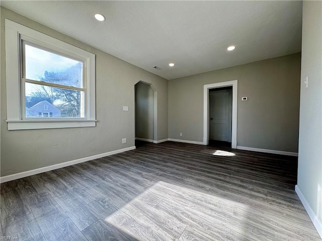 empty room featuring dark hardwood / wood-style floors