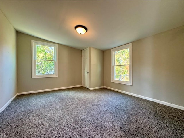 spare room with carpet and a healthy amount of sunlight