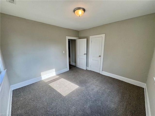 unfurnished bedroom with carpet flooring