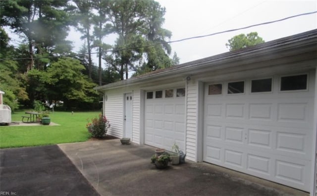 garage with a lawn